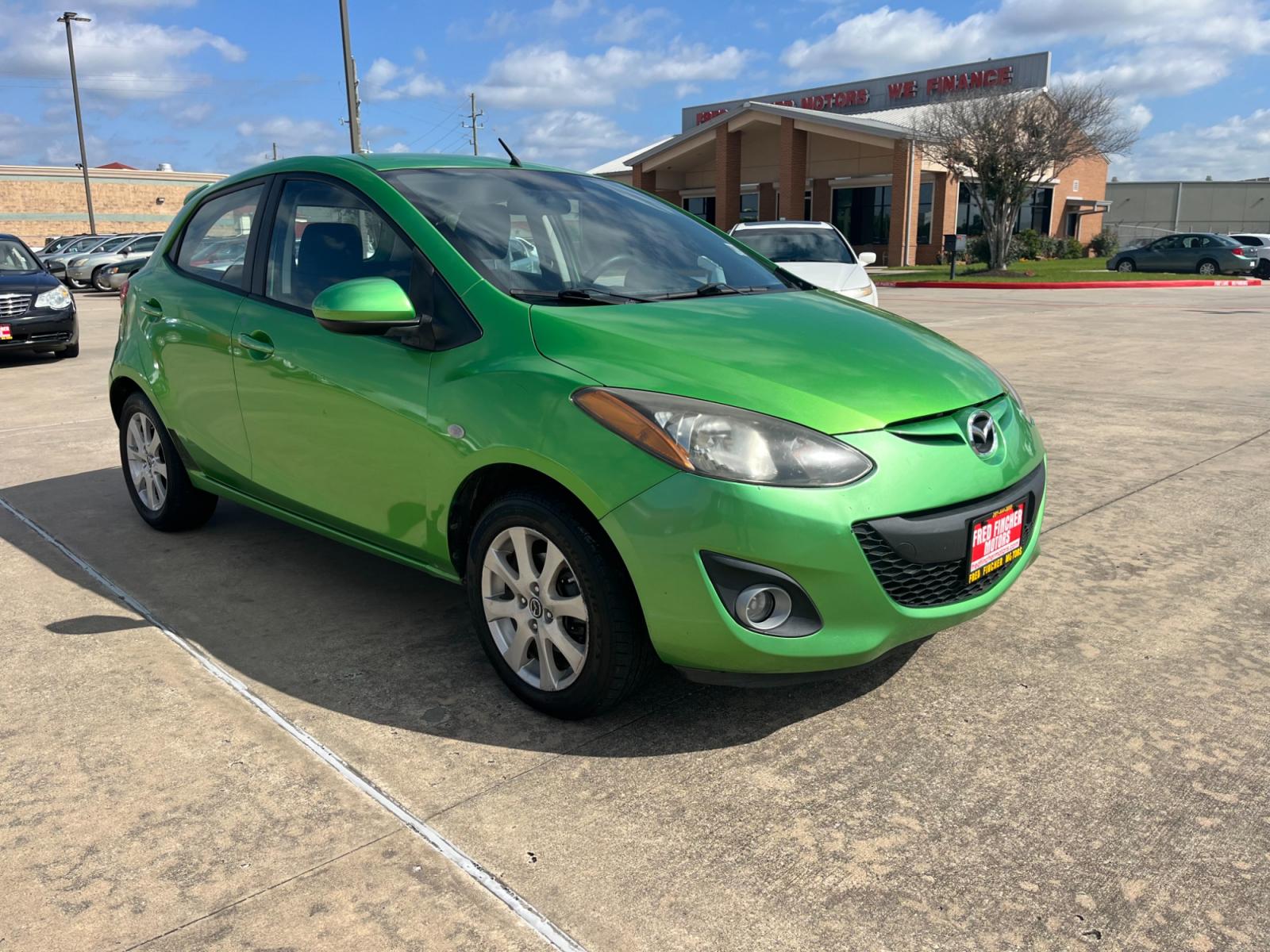 2013 green /black Mazda MAZDA2 Touring (JM1DE1LY1D0) with an 1.5L L4 DOHC 16V engine, Automatic transmission, located at 14700 Tomball Parkway 249, Houston, TX, 77086, (281) 444-2200, 29.928619, -95.504074 - Photo #0